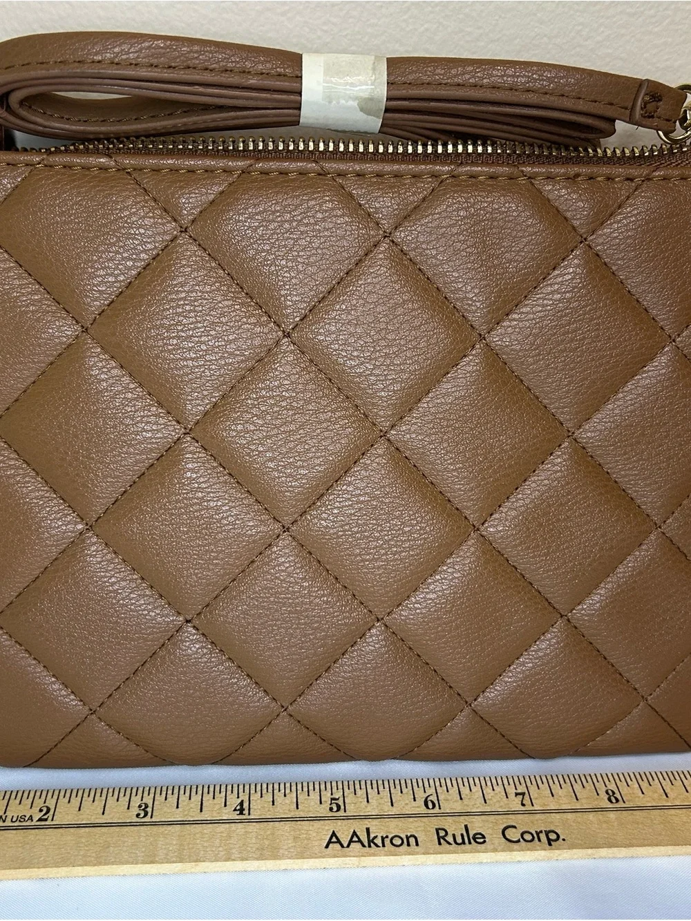 IMAN Quilted Tan Crossbody with Gold Medallion